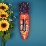 Furnshine - Handcrafted Orange Wooden Tribal Wall Mask with Purple Crown – Nazar Battu for Home Entrance, Living Room & Balcony Decor – 12 Inch Ethnic Hanging Art